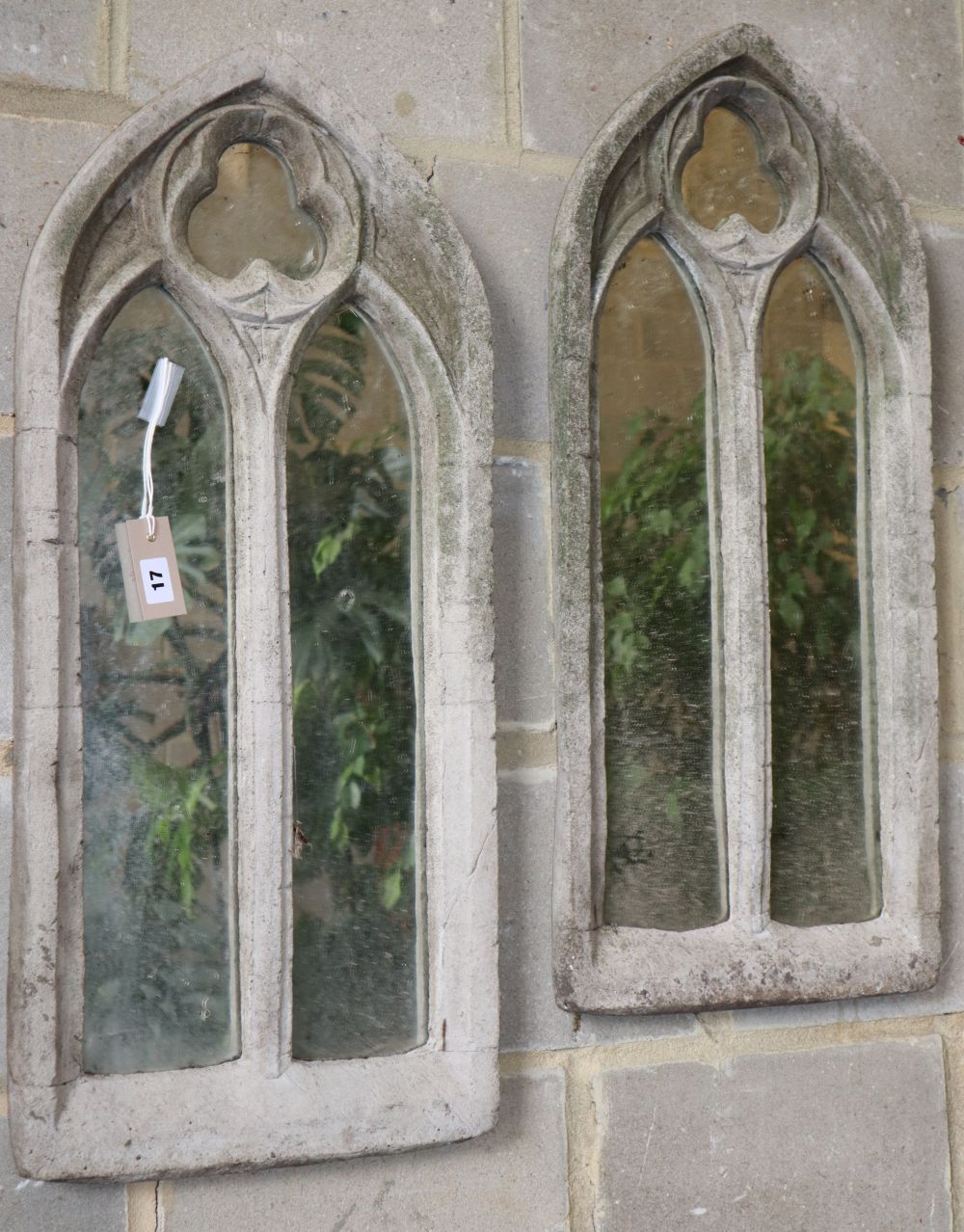 A pair of mirrored stone garden gothic panels, W.35cm, H.78cm